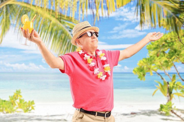 nice-older-man-with-cocktail-on-the-beach-feeling-refreshed